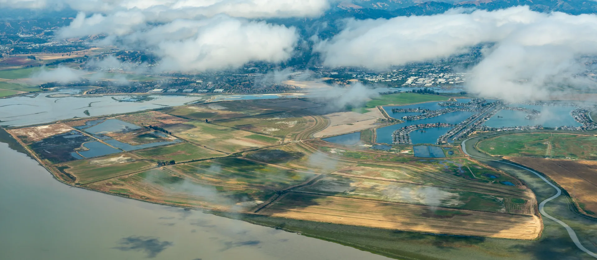 An aerial photo of the Sacramento River flowing into San Francisco Bay in the Delta estuary. Credit: Adobe Stock